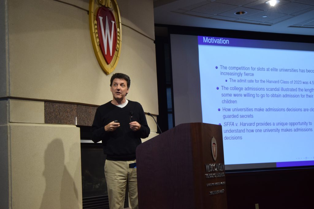 speaker presents their slide titled motivation