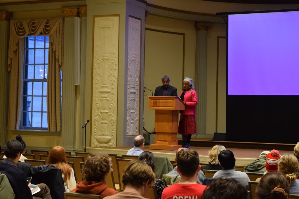 William Darity Jr and Kirsten Mullen present 'Reparation & the nation's capital' to a large audience behind a podium